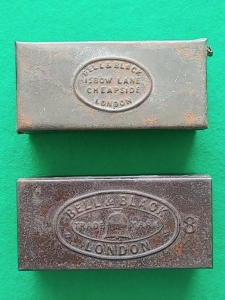 Two unusual No.8 tins, with and without number. Contents thought to be 750